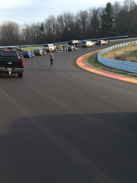 Caption: Checking out the new pavement at turn seven. Getting the opportunity to do a track walk is a powerful tool for learning a new track.