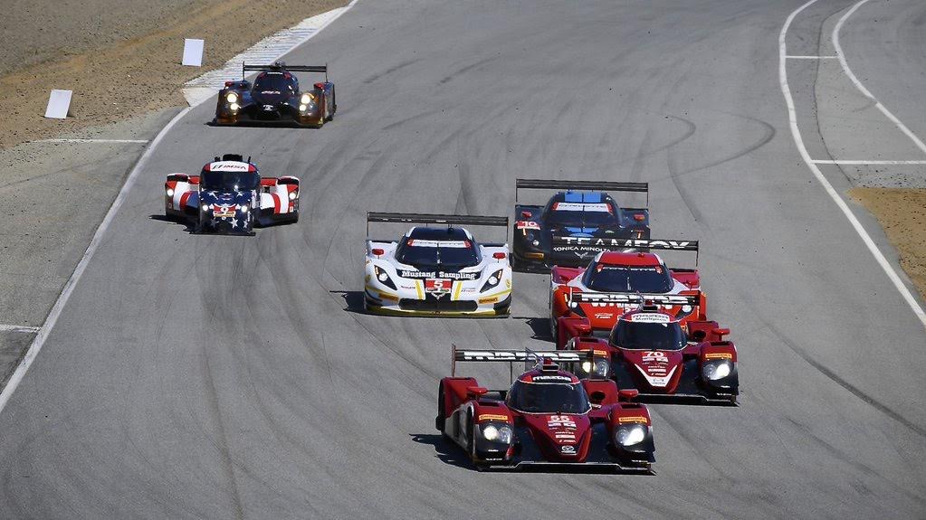 Mazdas lead the field into Andretti Hairpin at Mazda Raceway Laguna Seca.