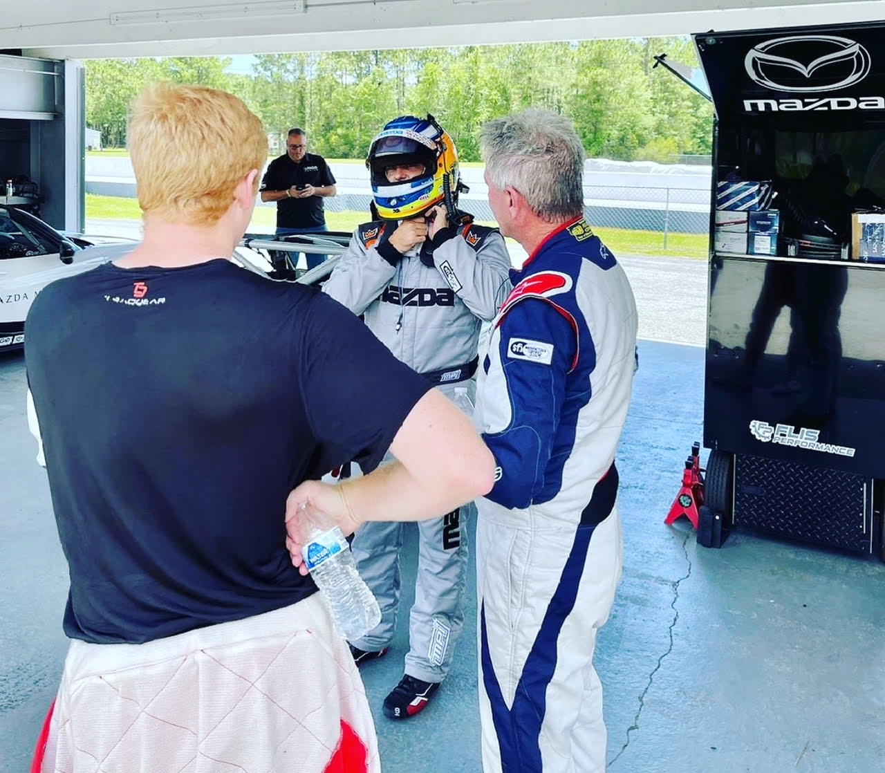 Chatting about the MX-5 Cup car between test sessions with Ross Bentley and current series champion, Michael Carter.