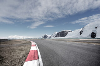 empty asphalt road with snow mountain